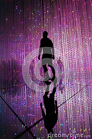 Man and other people in illuminated virtual multiverse concept Stock Photo