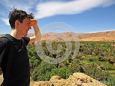 Man overlooking oasis Stock Photo