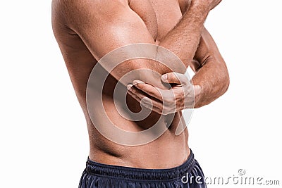 Man With Pain In Elbow. Pain concept Stock Photo