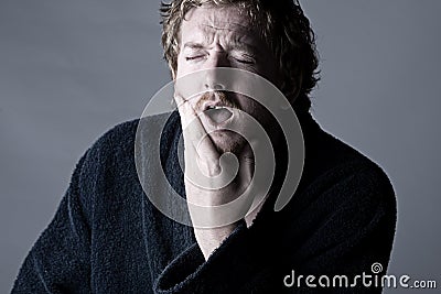 Man in Pain holding his Jaw. Toothache! Stock Photo
