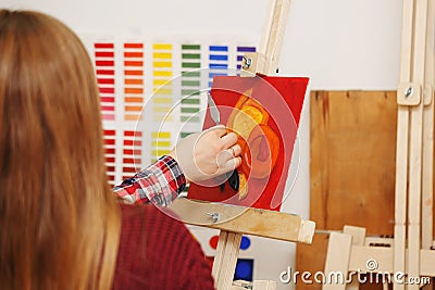 Man paints with oil paints Stock Photo