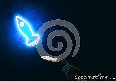 Man palm presenting Rocket web icon as technology concept Stock Photo