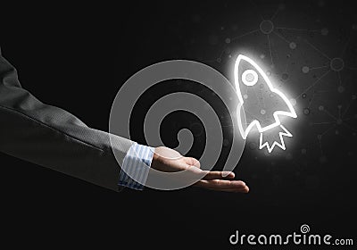 Man palm presenting Rocket web icon as technology concept Stock Photo