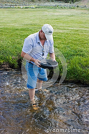 Man Panning For Gold Stock Photo