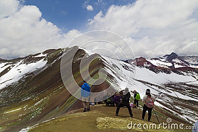 Man with panoramic view. Hiking scene in Vinicunca, Cusco region, Peru. Montana of Seven Colors, Rainbow Mountain Editorial Stock Photo