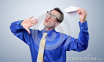 Man with a paper airplane dreams of flying Stock Photo