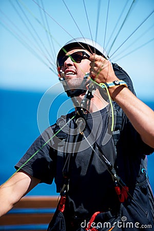 Man, parachute and paragliding launch in air in nature, exercise and healthy adventure fof extreme sport. Person, glide Stock Photo