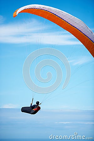 Man, paragliding and blue sky adventure parachute in clouds for explore city, outdoor courage or fearless athlete. Male Stock Photo