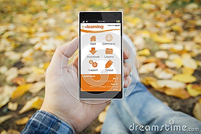 man in the park e-learning smartphone Stock Photo