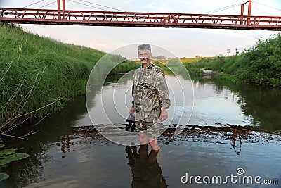 The man passing the river Stock Photo