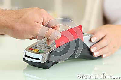 Man paying with credit card reader in a shop Stock Photo