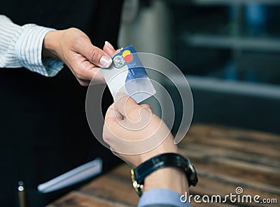 Man paying with credit card at the restaurant Stock Photo