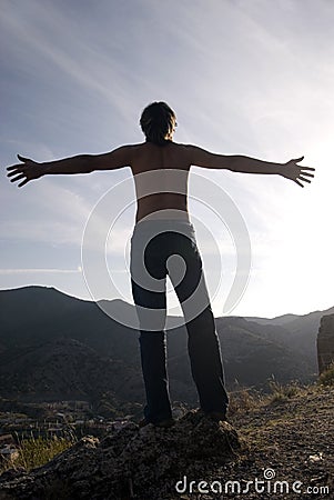 Man on peak of mountain Stock Photo