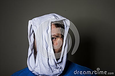 Man peeking out through the hole in the underwear on his head Stock Photo