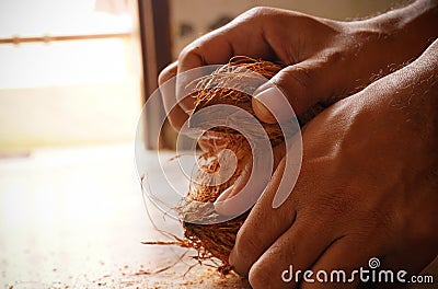 man peeling coconut Stock Photo