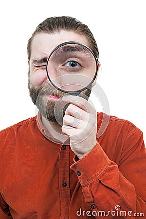 Man Peering through Magnifying Glass Stock Photo