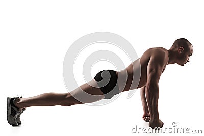 Man performing push-ups exercise on fists Stock Photo