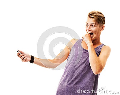 Man, phone and biting hand in studio for message, notification or internet text on white background with surprise Stock Photo