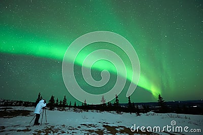 Man photographing the Aurora Borealis Stock Photo