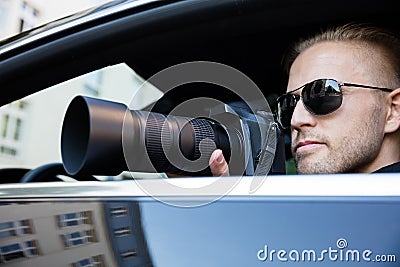 Man Photographing With SLR Camera Stock Photo