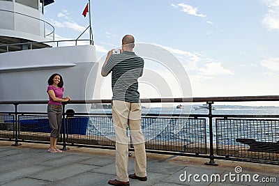 Man photographing woman Stock Photo