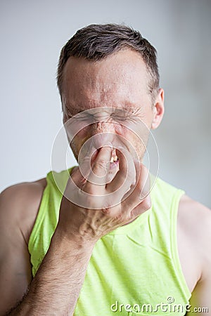 Man Pinches Nose Looks With Disgust Something Stinks Bad Smell Stock Photo