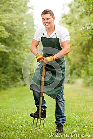 Man with pitchfork Stock Photo