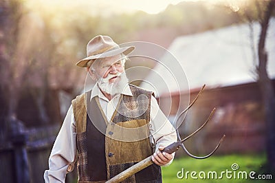 Man with pitchfork Stock Photo