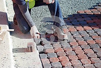 Man Placing Paving Stones Stock Photo