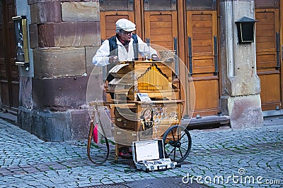 A man is playing on barrel organ Editorial Stock Photo