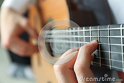 Man playing on classic guitar Stock Photo