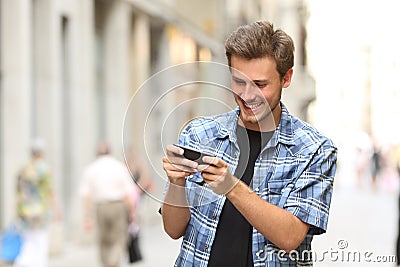 Man playing game with a smart phone Stock Photo