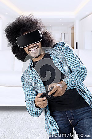 Man playing game with virtual reality glasses Stock Photo