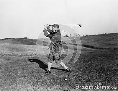 Man playing golf Stock Photo