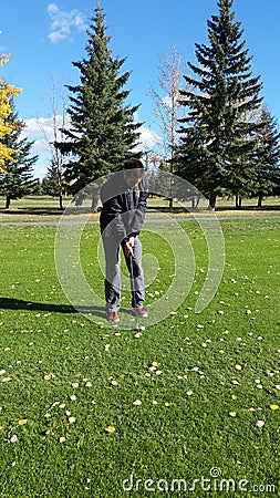 Man playing golf Editorial Stock Photo