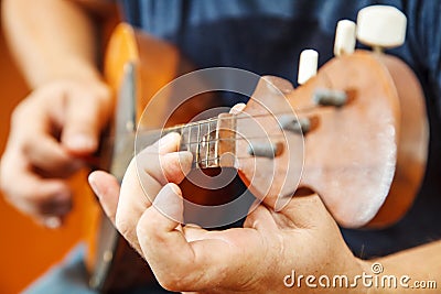 Man playing the mandolin. hands closeup Stock Photo