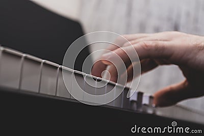 A man playing a keyboard instrument Stock Photo