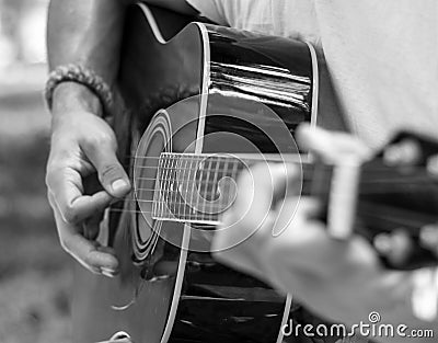 Man plays guitar in black and white tones Stock Photo