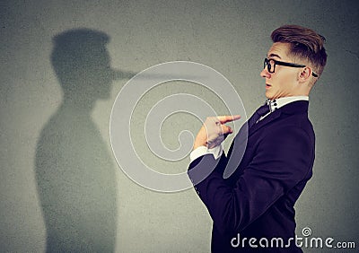 Man pointing at himself while lying Stock Photo