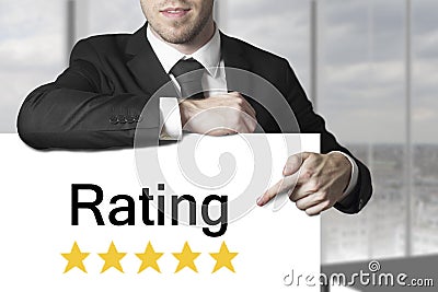 Man pointing on sign rating stars Stock Photo