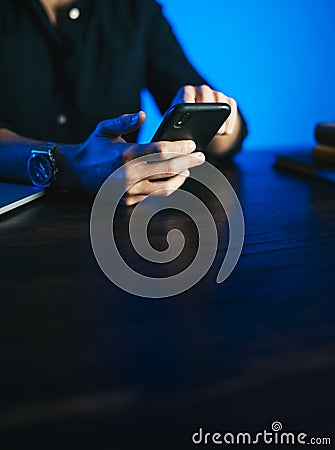 Man pointing on smartphone screen, chatting in social networks, meeting website, searching internet, sending sms, using text Stock Photo