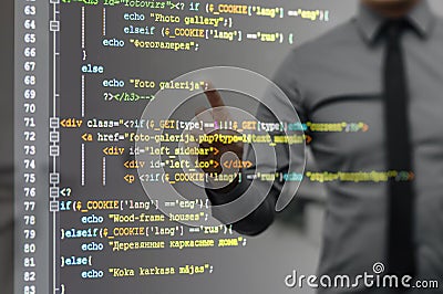 Man pointing on virtual screen with website programming code Stock Photo