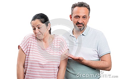 Man pointing at woman with disinterested expression Stock Photo