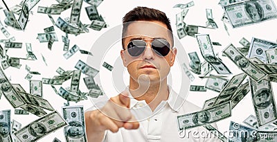 Man pointing on you with falling dollar money Stock Photo