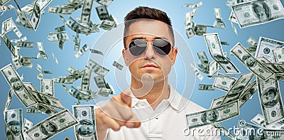 Man pointing on you with falling dollar money Stock Photo