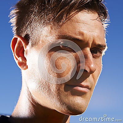 Man, portrait and confident soccer player in outdoors, athlete and competitive for match or game. Male person, serious Stock Photo