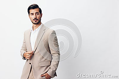 man portrait copyspace business happy handsome businessman smiling suit beige posing Stock Photo