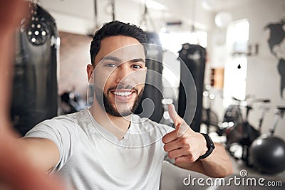 Man, portrait and selfie at a gym for fitness with thumbs up for wellness or health in a close up. Male person, selfies Stock Photo