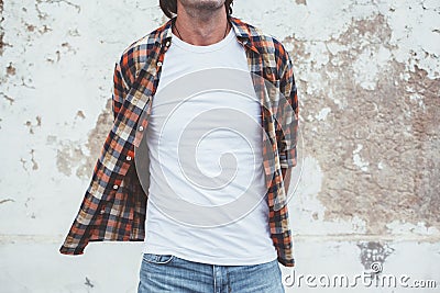 Man posing in blank white tshirt against street wal Stock Photo