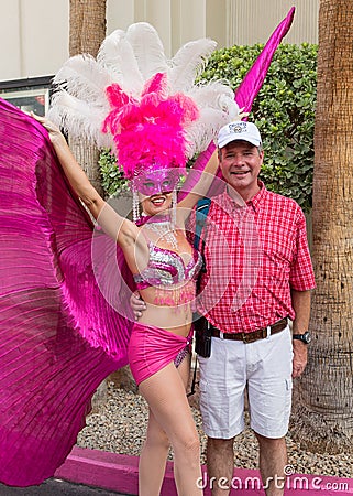 Man posing with showgirl Editorial Stock Photo